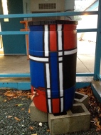 A third view of the Mondrian rain barrel, placed on "The Hill"