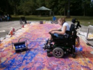 This student drove her chair (carefully) all over the canvas while adding her large print to the piece!