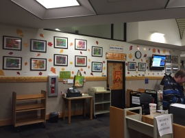 Our students' art on display behind the circulation desk!
